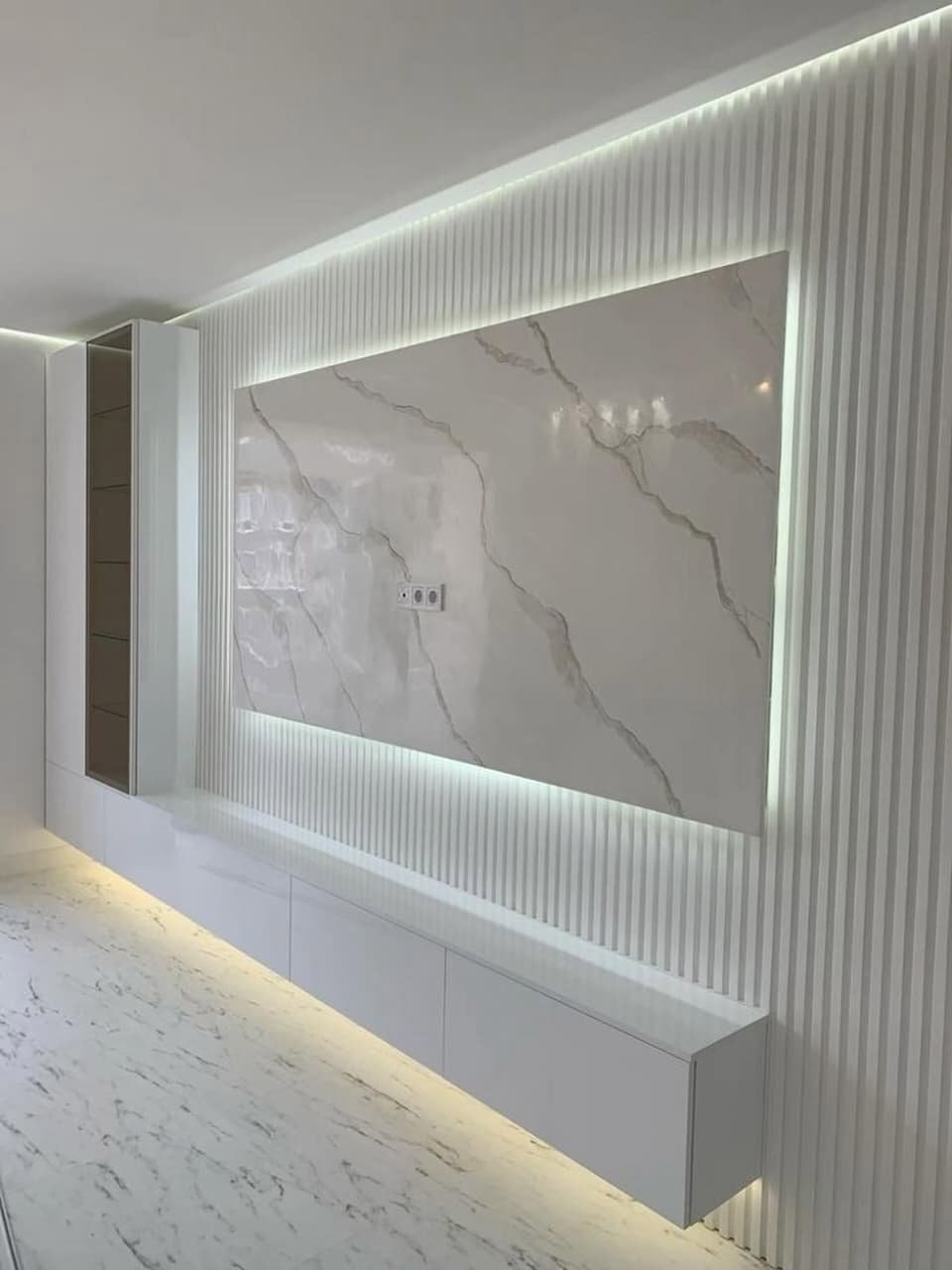 "Light, marble & minimalism at its finest."
Crisp white fluted panels, soft glowing LED backlighting, elegant marble slab, and sleek floating cabinet. Airy, spacious, and serene. ☁️