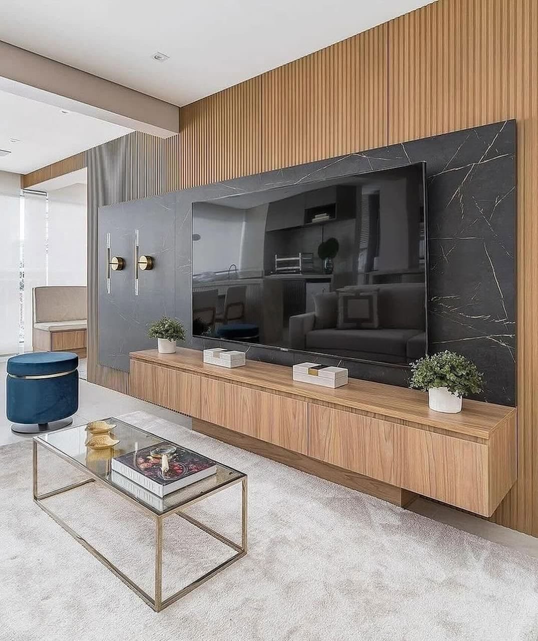 Natural wood floating console, dramatic dark marble feature wall, vertical fluted panels, and elegant decor accents. High-end living room elegance. 🖤